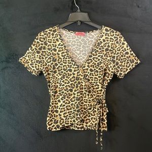 Cheetah print shirt, tight right at your waist area for an hourglass appeal!